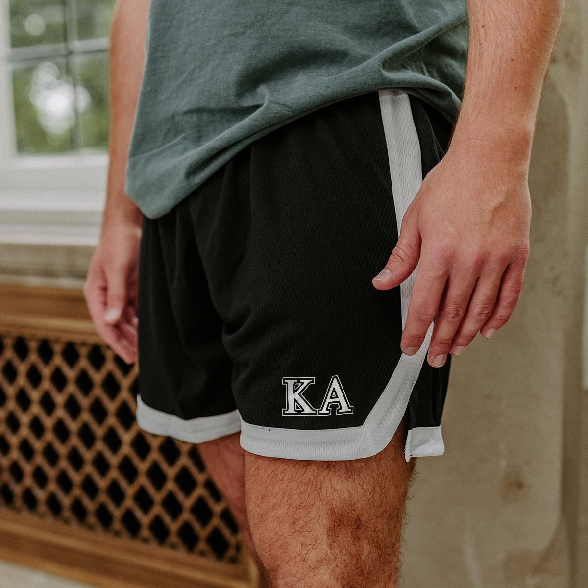 Kappa Alpha Greek Fraternity Black 7" Mesh Shorts with Greek letters.