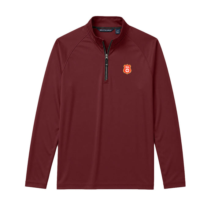 Maroon Cutter + Buck Adapt quarter zip pullover with embroidered crest on the left chest, stand-up collar, and black zipper detailing.