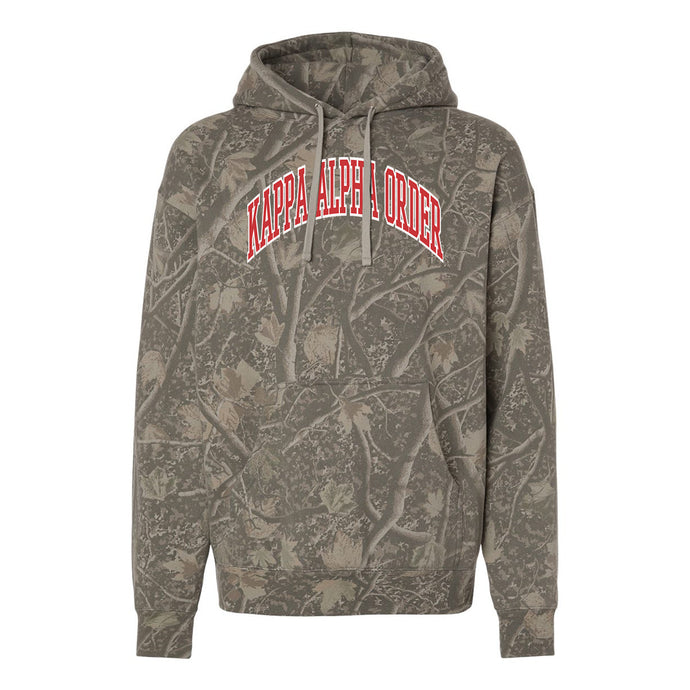 Kappa Alpha Deadwood Camo Hoodie featuring an all-over woodland camouflage print, red and white arched Kappa Alpha Order lettering, drawstring hood, and kangaroo pocket.