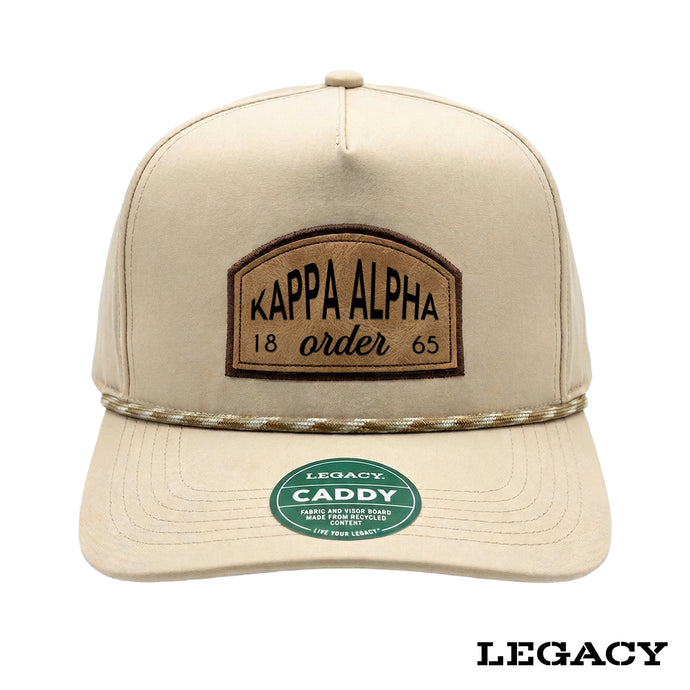 Cream Legacy brand rope hat featuring a brown fraternity patch, designed for stylish fraternity apparel and casual campus wear.