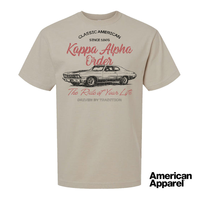 Beige T-shirt displayed on a plain background with a vintage-inspired graphic of a classic muscle car, mixed typography, and a soft red and black print design.