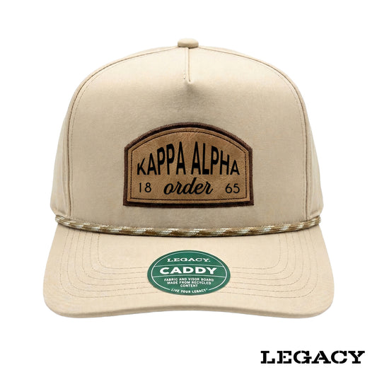 Cream Legacy brand rope hat featuring a brown fraternity patch, designed for stylish fraternity apparel and casual campus wear.