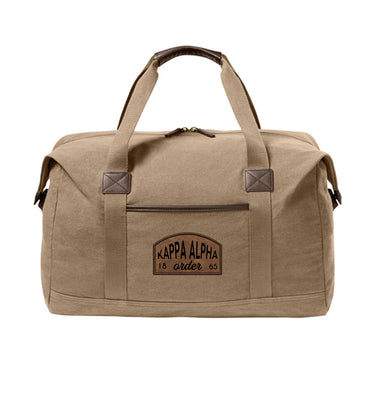 Fraternity Tan Canvas Duffel Bag with leather patch on front.